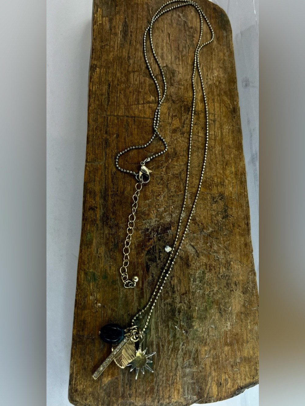 Boho Gold Layered Charm Necklace with Starburst, Leaf, & Crystal Accents - sku96 - Picture 2 of 3